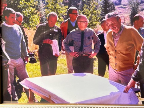 Image featuring men gathered around the early planning for the Mineral King Project. Bob's father on the far left, Walt Disney on the right.